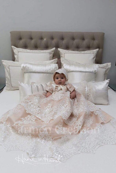 Photograph sent in by one of our customers. Couldn't have gotten a better photo of our best selling Baptism Gown.